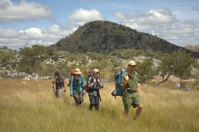 Leading a hike across Lavushi Manda with students from the American Wildlands Studies Programme in 2012, some of the first tourists to have properly explored Lavushi (photograph by Travis Lund).